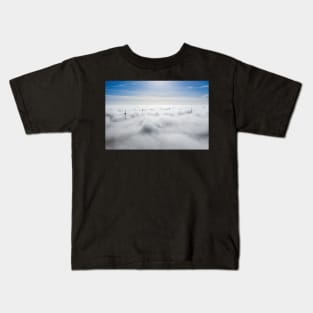 Wind farms sticking out above the clouds Kids T-Shirt